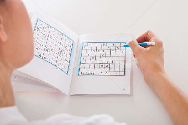 Woman Solving Sudoku Stock photo © AndreyPopov