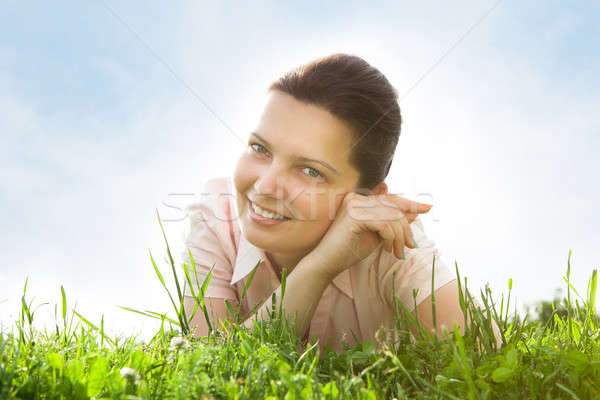 Young Woman Relaxing In Grassland Stock photo © AndreyPopov