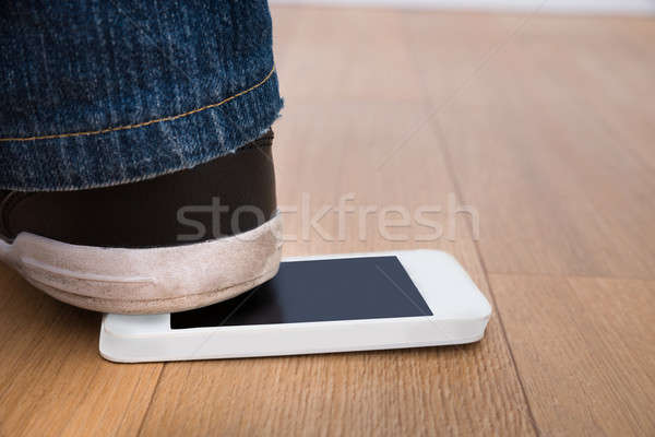 Foot On Cellphone Stock photo © AndreyPopov