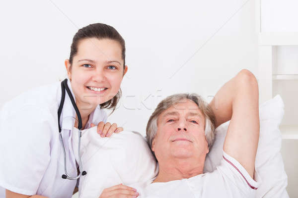 Female Doctor With Senior Male Patient Stock photo © AndreyPopov