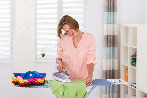 Stock photo: Woman Ironing Clothes