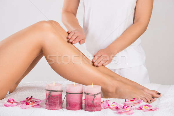 Beautician Waxing Woman's Leg At Salon Stock photo © AndreyPopov