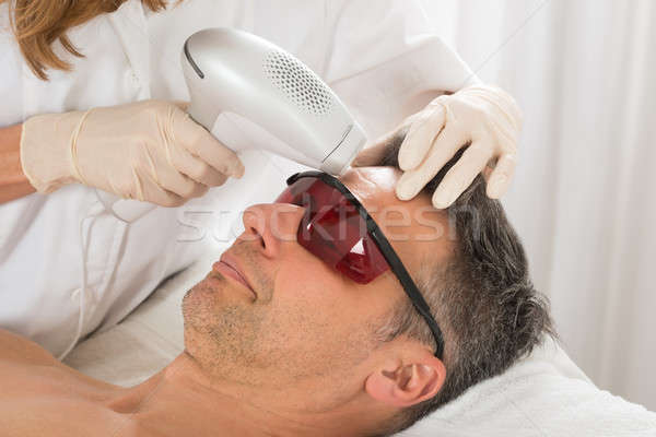 Man Receiving Laser Epilation Treatment Stock photo © AndreyPopov