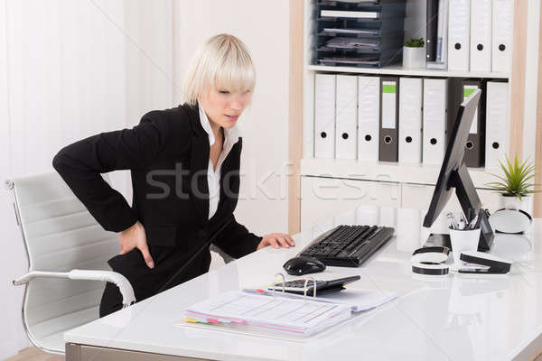 Geschäftsfrau Leiden Rückenschmerzen jungen Büro Computer Stock foto © AndreyPopov