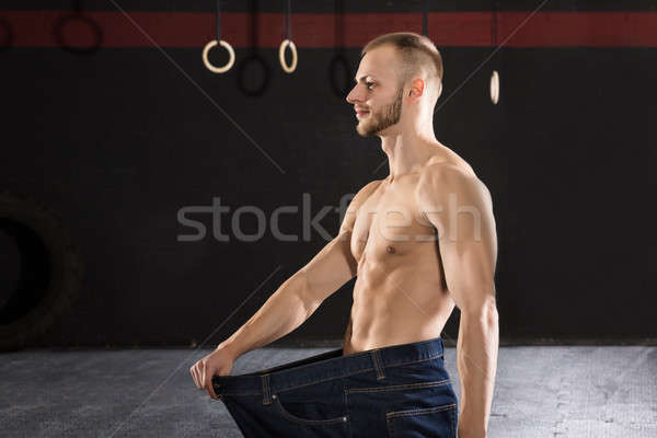 Férfi visel bő tornaterem fiatal atléta Stock fotó © AndreyPopov