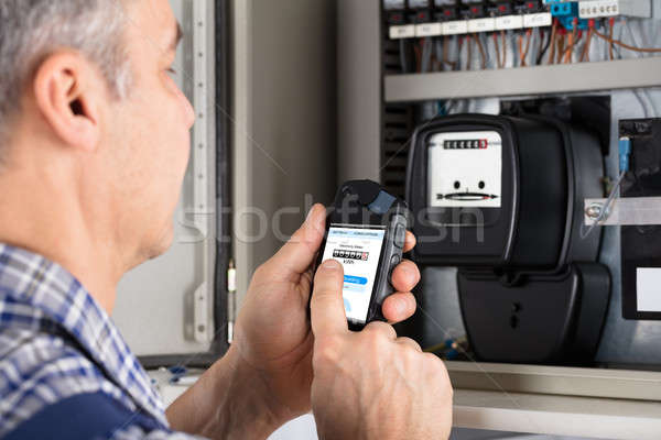 Male Technician Doing Meter Reading Stock photo © AndreyPopov