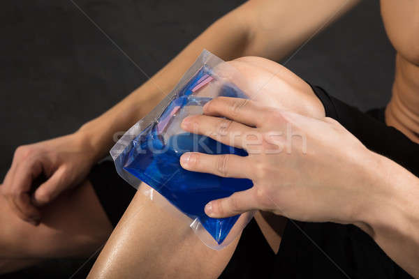 Person Applying Ice bag On Knee Stock photo © AndreyPopov