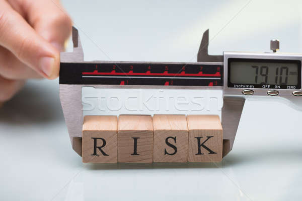 Person Measuring Risk Blocks With Digital Electronic Caliper Stock photo © AndreyPopov