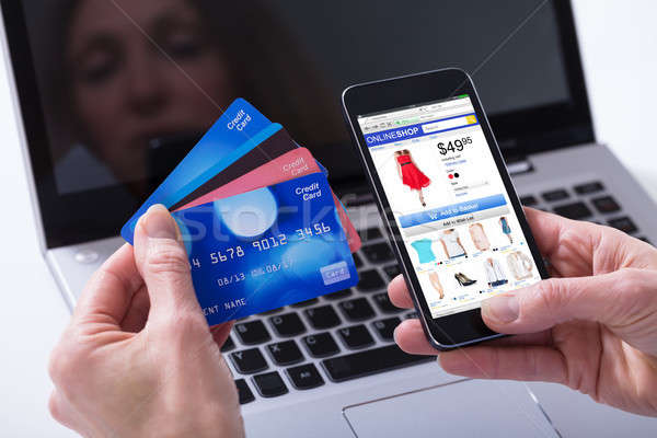 Woman Shopping Online With Credit Cards On Mobile Phone Stock photo © AndreyPopov