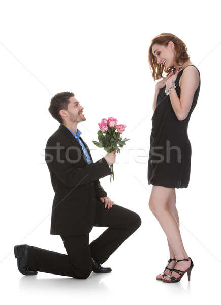 Mann bieten Blume schöne Frau junger Mann weiß Stock foto © AndreyPopov