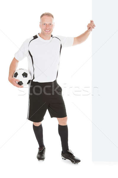 Soccer Player Pointing At Billboard Stock photo © AndreyPopov