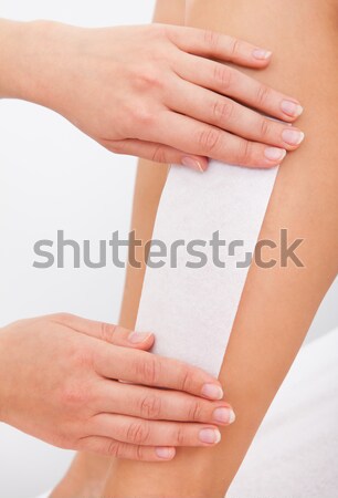 Beautician Waxing A Woman's Leg Stock photo © AndreyPopov
