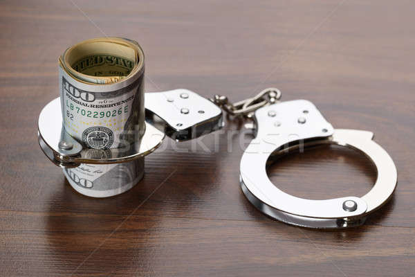 Handboeien omhoog geld Stockfoto © AndreyPopov