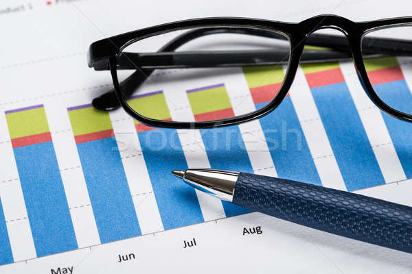 Financial Graph With Eyeglasses And Pen Stock photo © AndreyPopov