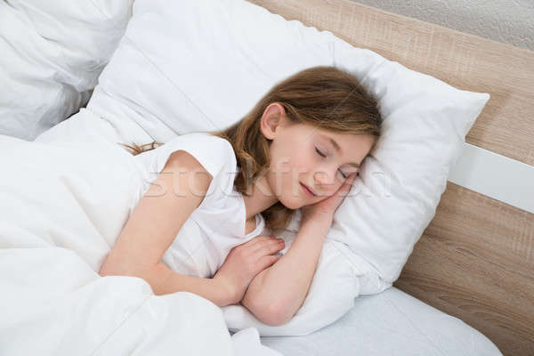 Girl Sleeping In Bed Stock photo © AndreyPopov