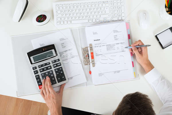 Empresario factura primer plano calculadora negocios oficina Foto stock © AndreyPopov