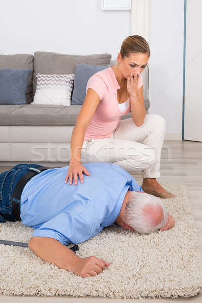 Woman Looking At Her Fainted Disabled Father Stock photo © AndreyPopov