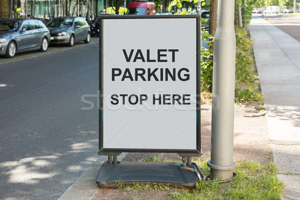 Valet parking sign on board by street Stock photo © AndreyPopov