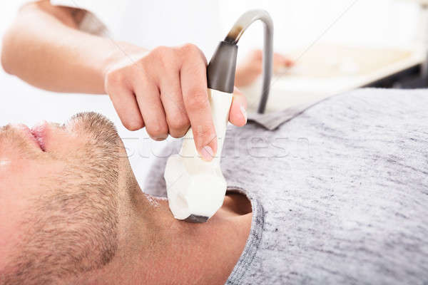 Patient Undergoing Ultrasound Of Thyroid Gland Stock photo © AndreyPopov