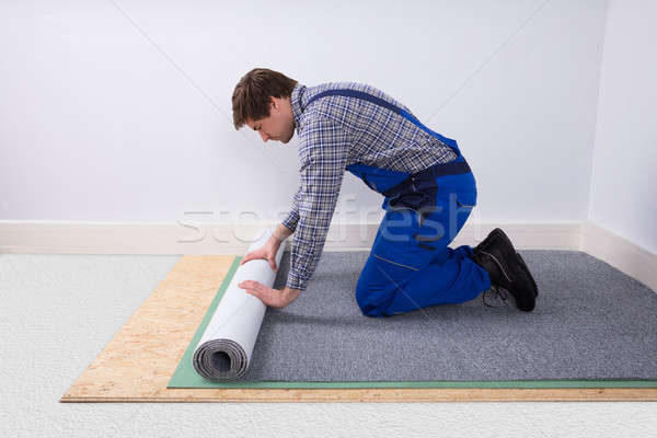 Worker Installing Carpet Stock photo © AndreyPopov