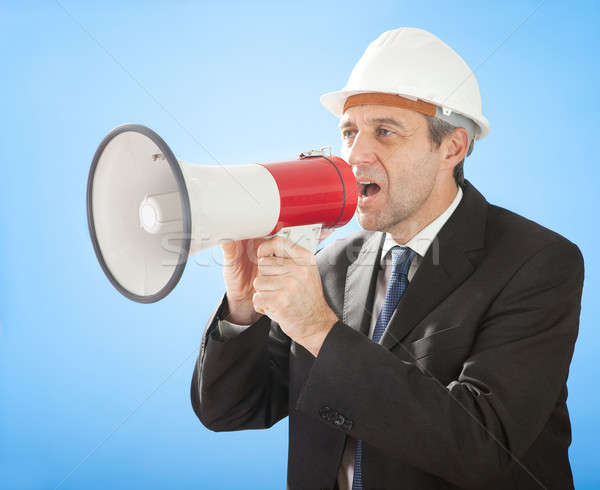 Senior architect shouting into megaphone Stock photo © AndreyPopov