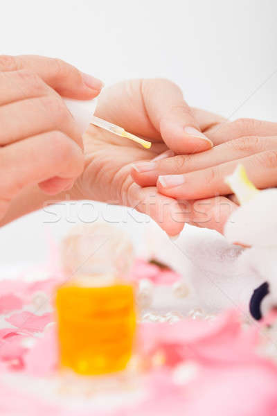 Manicurist Applying Nail Varnish Stock photo © AndreyPopov