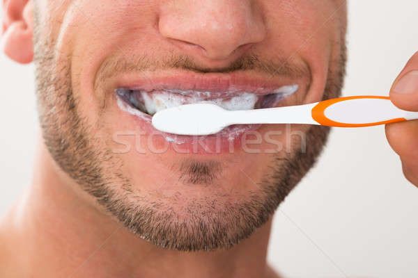 Man jonge man tand borstel Stockfoto © AndreyPopov