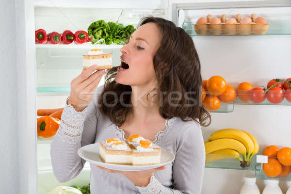 Woman Eating Slice Of Cake Stock photo © AndreyPopov