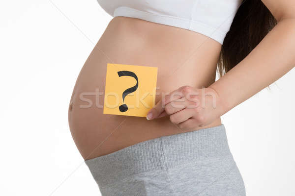 Pregnant Woman Holding Paper With Question Mark Stock photo © AndreyPopov