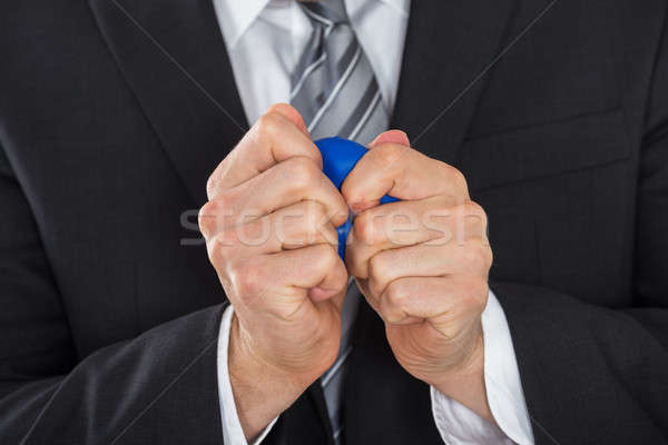 Businessman Pressing Stress Ball Stock photo © AndreyPopov