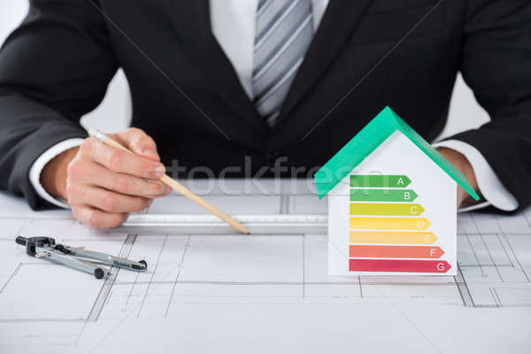 Architect Working On Blue-print In Office Stock photo © AndreyPopov