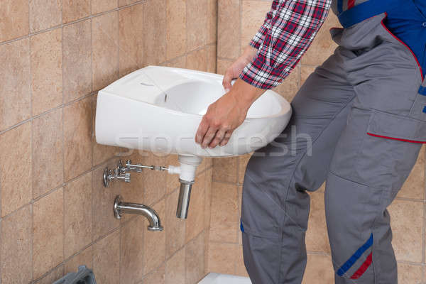 Handyman Installing Sink In Bathroom Stock photo © AndreyPopov