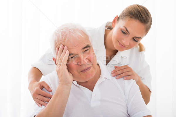 Doctor Consoling Male Patient Stock photo © AndreyPopov