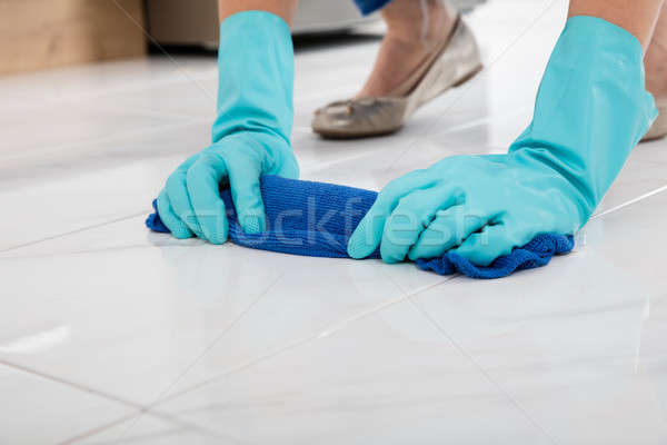 Person Cleaning Floor With Cloth Stock photo © AndreyPopov