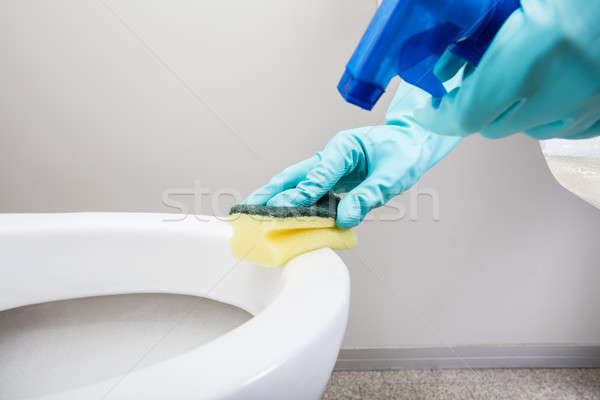 Person Hand Cleaning Toilet Using Sponge Stock photo © AndreyPopov