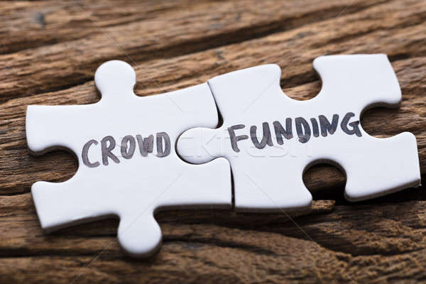 Closeup Of Connected Crowd Funding Jigsaw Pieces Stock photo © AndreyPopov