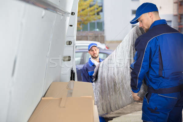 Two Movers Unloading Furniture From Truck Stock photo © AndreyPopov