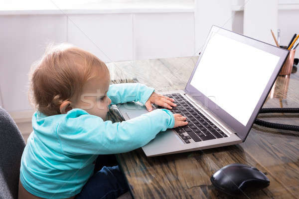 Stock photo: Baby Girl Using Laptop