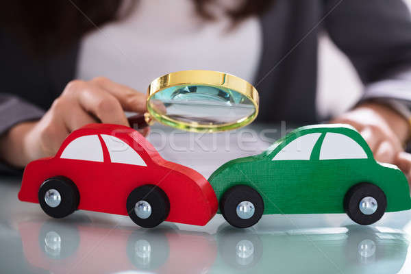 Stock photo: Close-up Of Two Wooden Car On Desk
