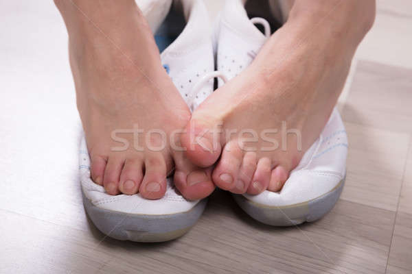 Woman's Leg Over Footwear Stock photo © AndreyPopov