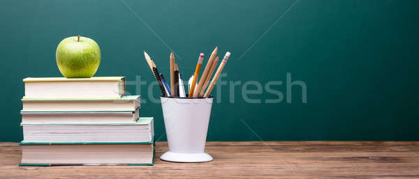 Green Apple On Top Of Stacked Books Stock photo © AndreyPopov