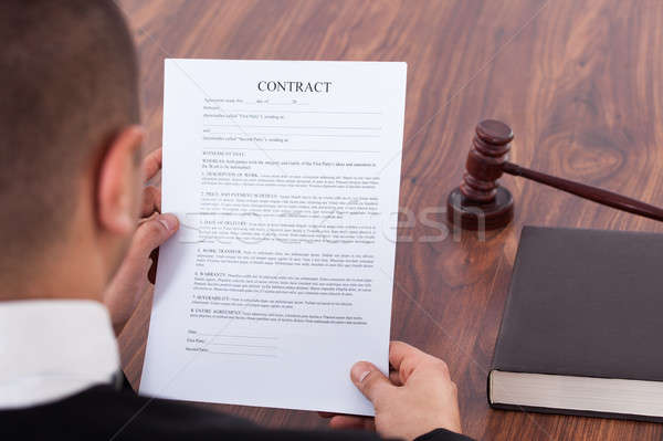 Judge Reading Contract In Courtroom Stock photo © AndreyPopov