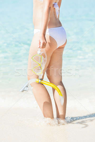 Woman Holding Snorkel While Standing In Sea Stock photo © AndreyPopov