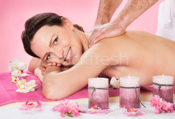 Woman Receiving Back Massaging In Spa Stock photo © AndreyPopov
