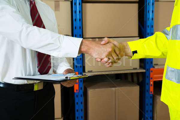 Close-up Of Businessman And Warehouse Worker Shaking Hands Stock photo © AndreyPopov