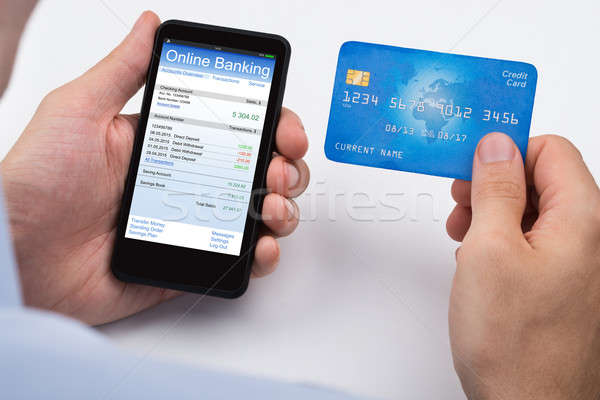 Személy hitelkártya mobiltelefon közelkép online bankügylet Stock fotó © AndreyPopov