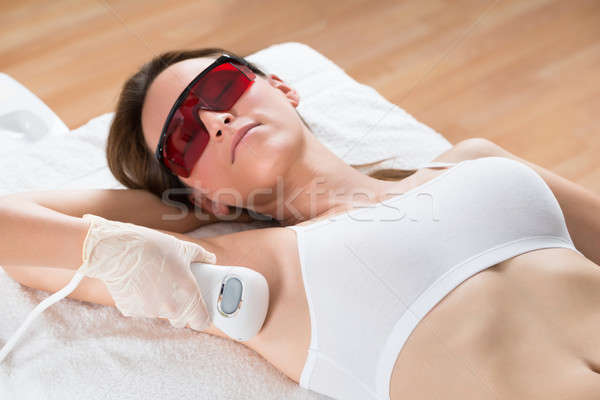 Beautician Removing Hair Of Woman With Epilator Stock photo © AndreyPopov
