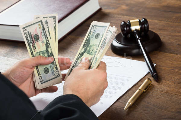 Corrupt Judge Counting Money At Desk Stock photo © AndreyPopov
