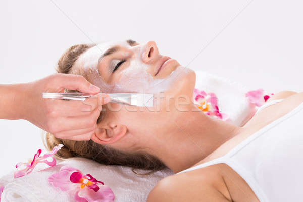 Beautician Applying Mask On Customer's Face At Salon Stock photo © AndreyPopov