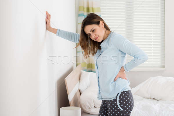 Young Woman Suffering From Back Pain Stock photo © AndreyPopov